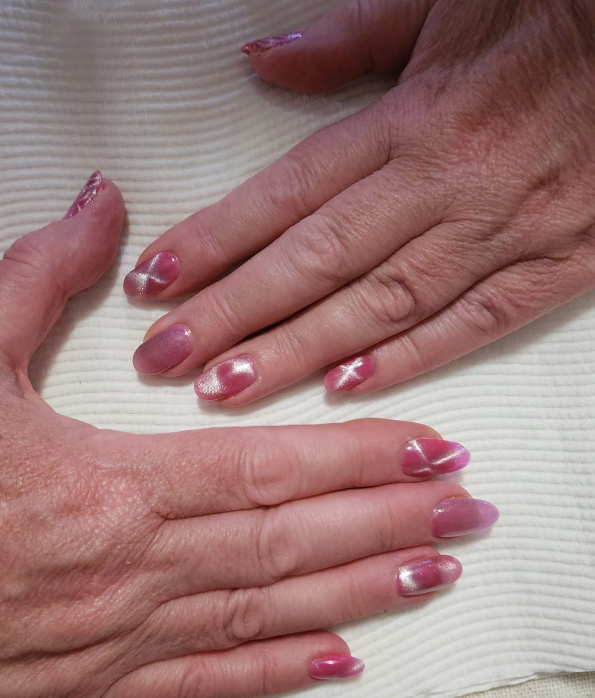 A soft pink shimmer manicure