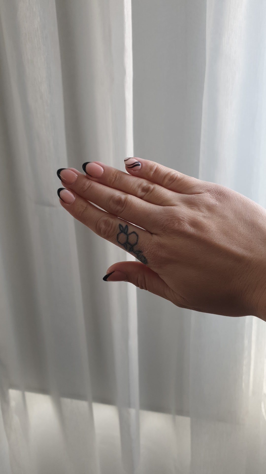 Natural pink nails with fine black tips
